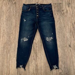 Dark blue distressed jeans